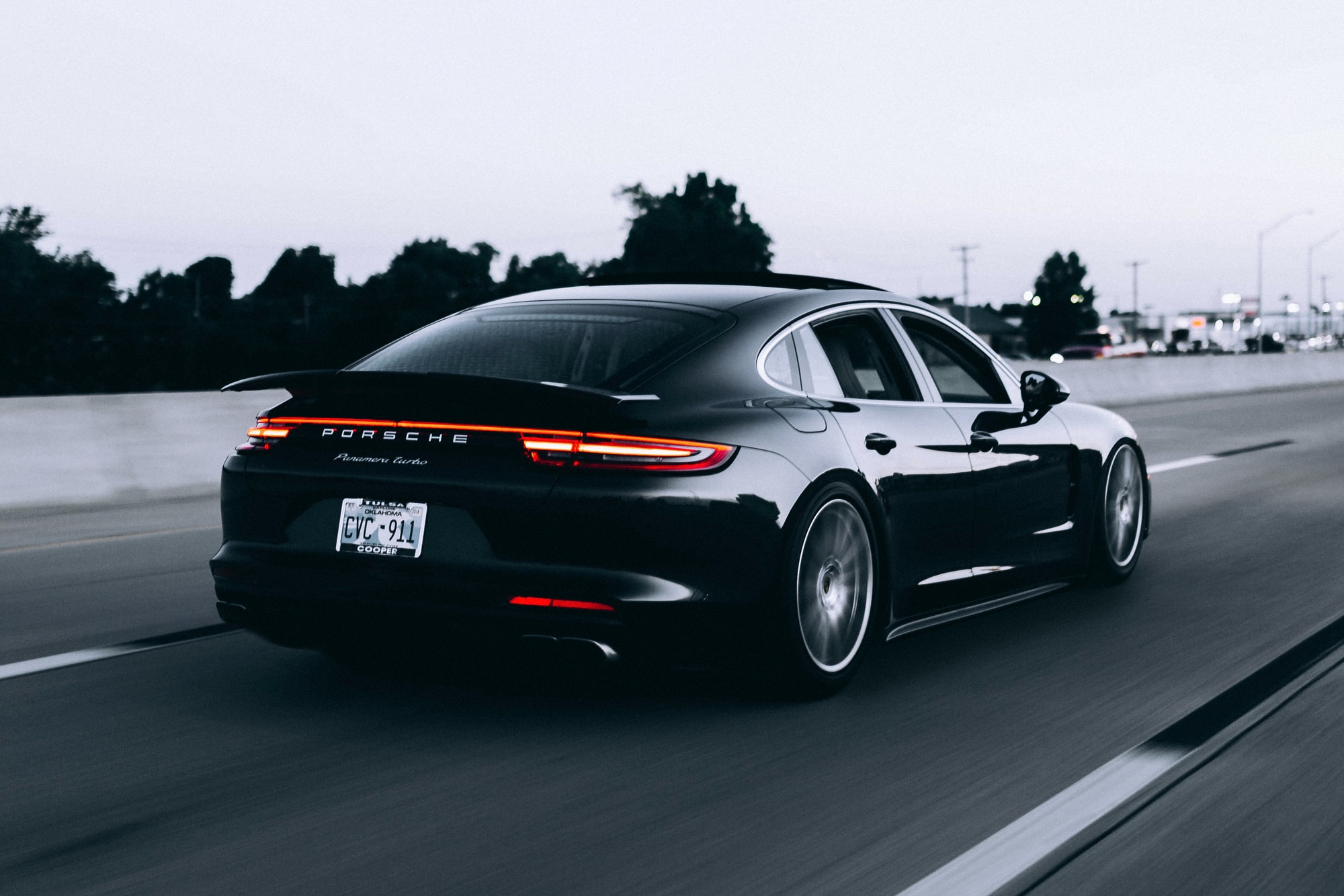 Black Porsche On The Road In Action